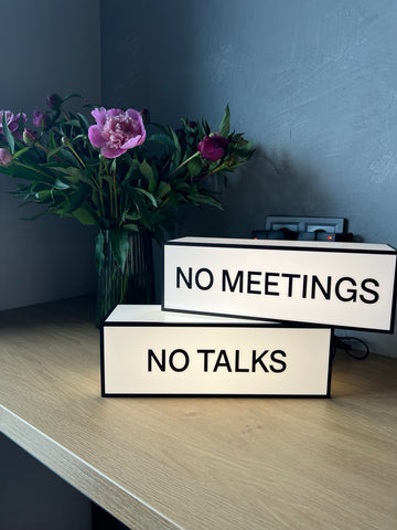 A lamp with your logo/text in the format "Do not lean"