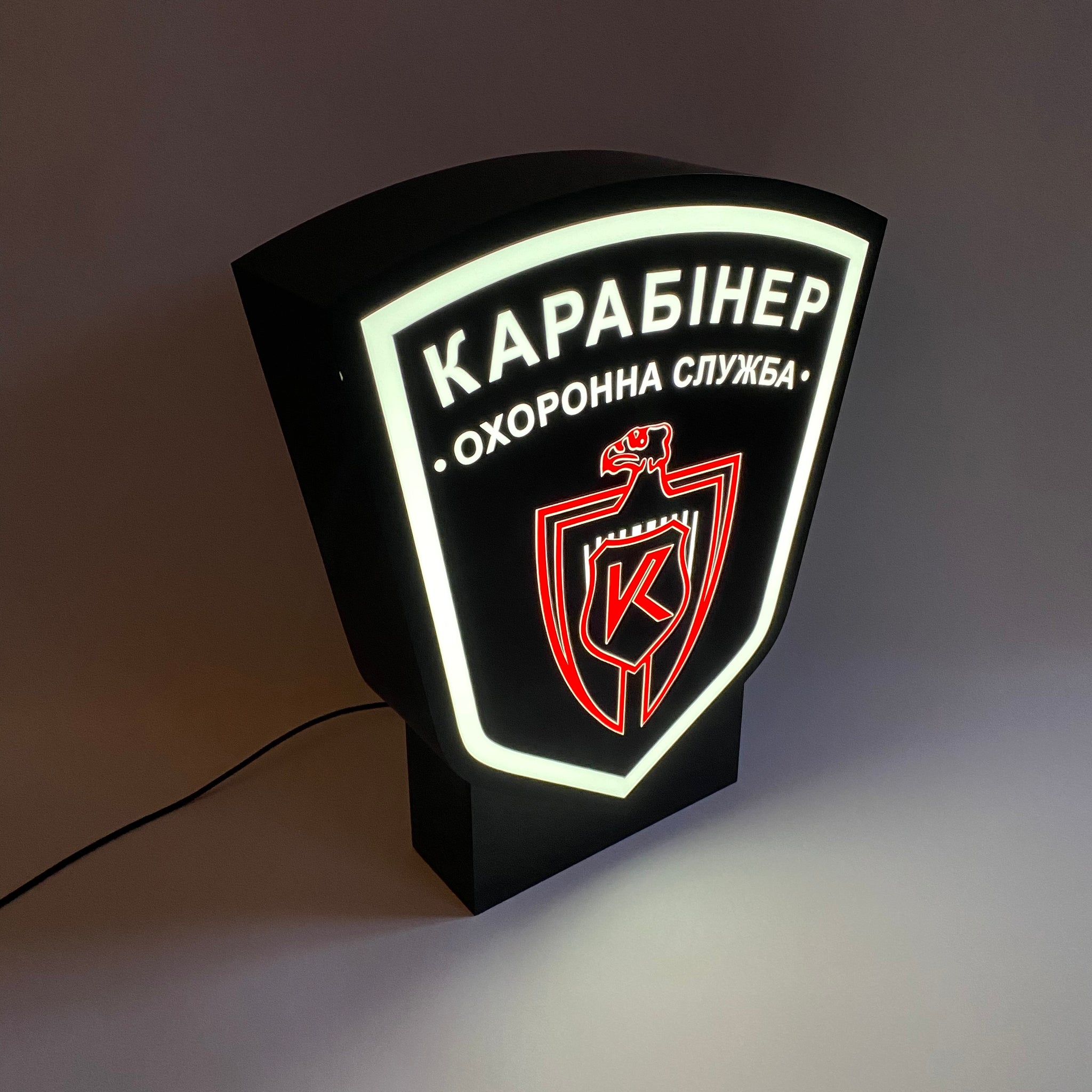 A lamp in the shape of a coat of arms with your image on a stand (height 35 cm)