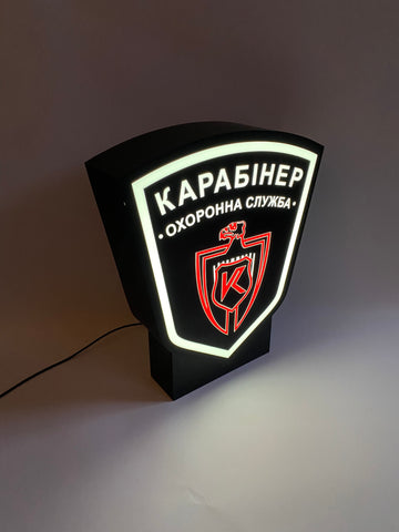 A lamp in the shape of a coat of arms with your image on a stand (height 35 cm)