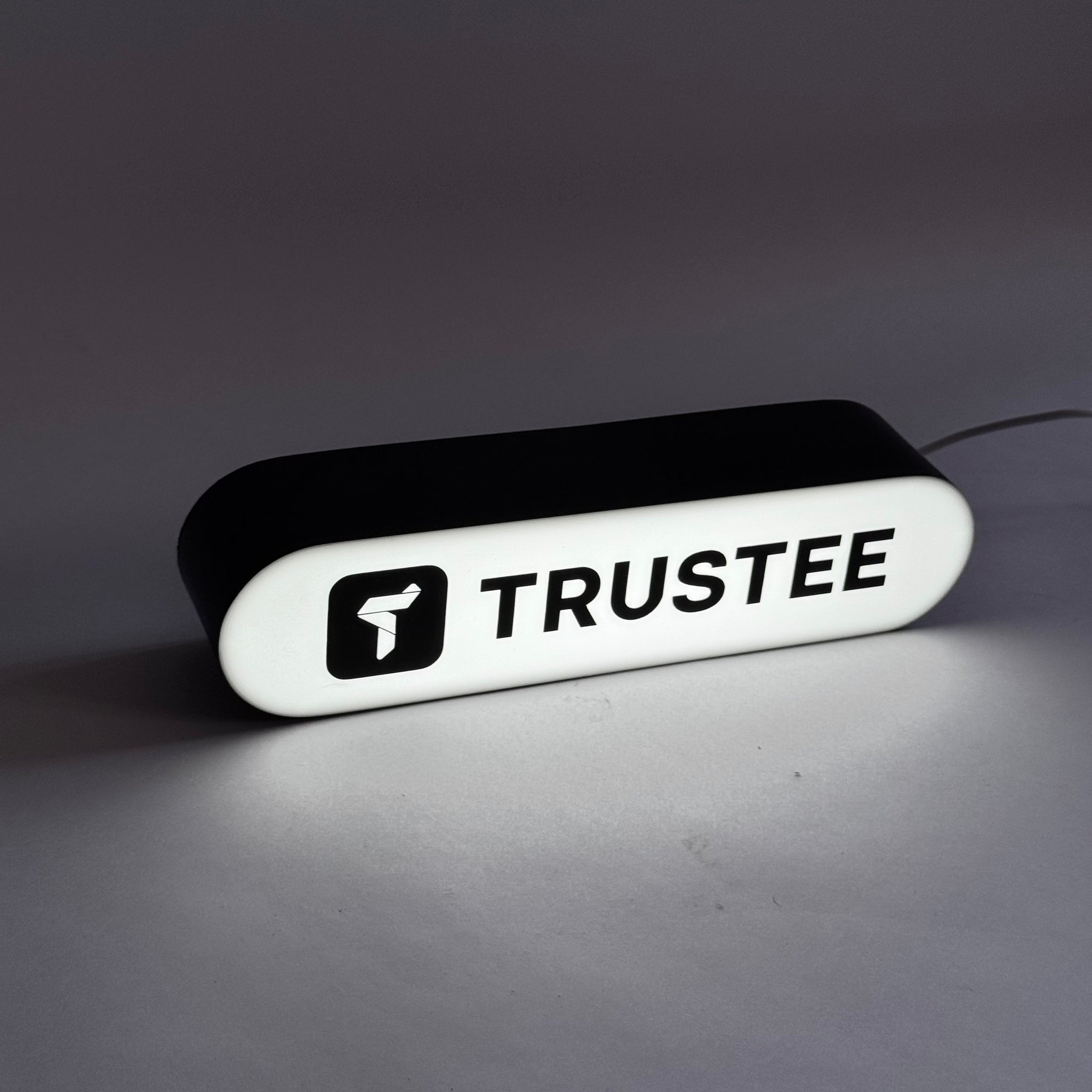 A rectangular lamp with rounded edges with your logo/text in the format 25x6x7 cm