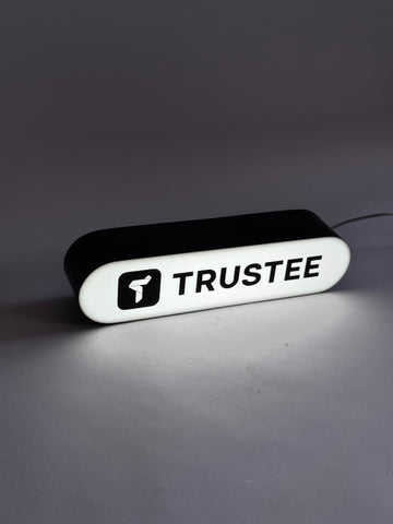 A rectangular lamp with rounded edges with your logo/text in the format 25x6x7 cm