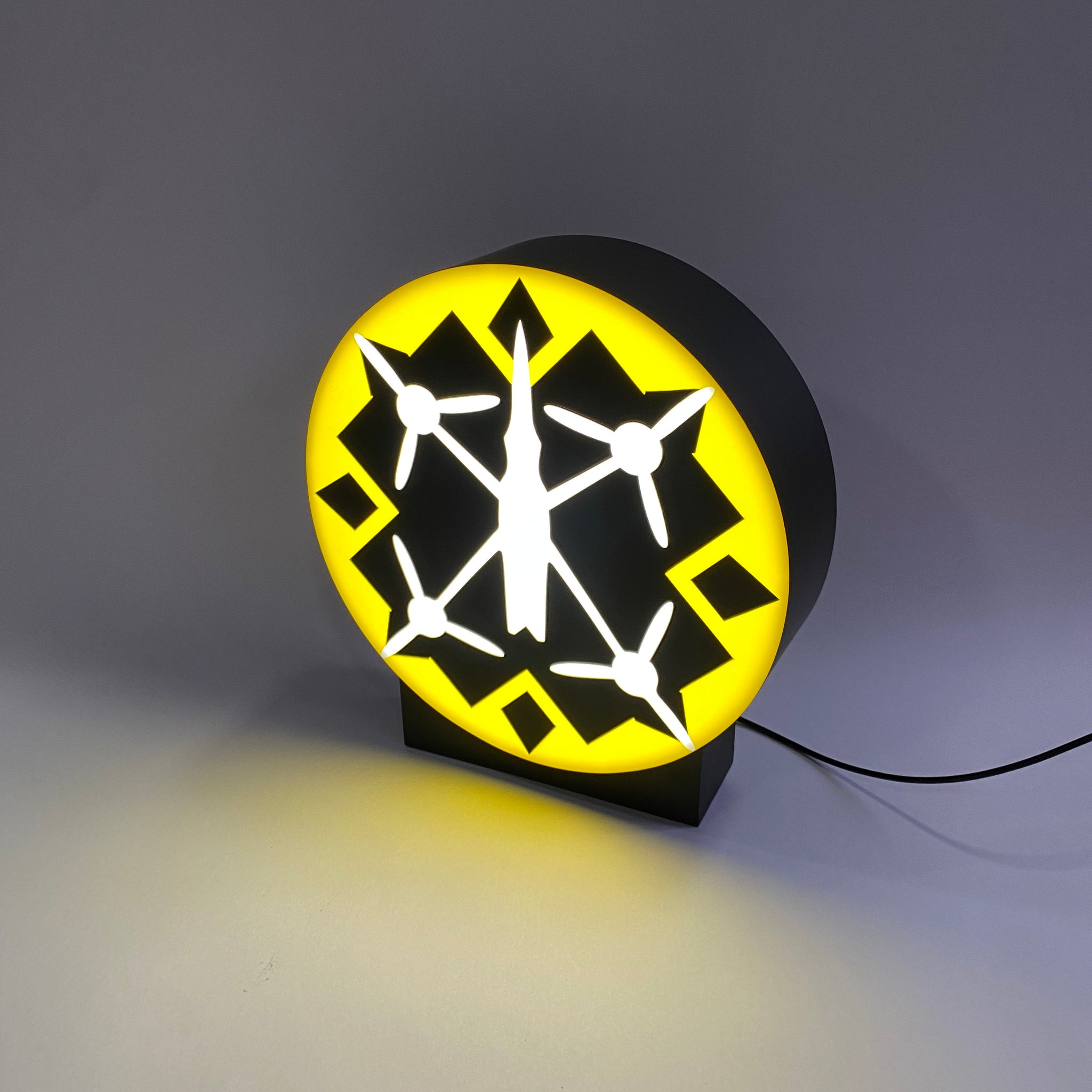A lamp on a stand with your logo/text in the format 25x25 cm