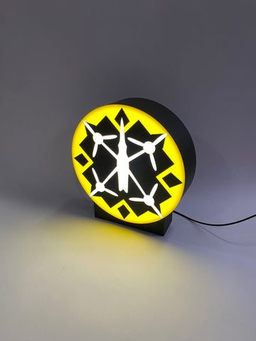 A lamp on a stand with your logo/text in the format 25x25 cm