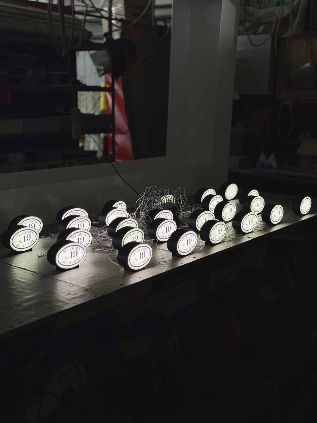 An oval lamp on a stand with your logo/text in the format 15х10,5х5 cm