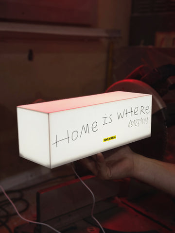 A lamp with your logo/text in the format "Do not lean" 5 light sides