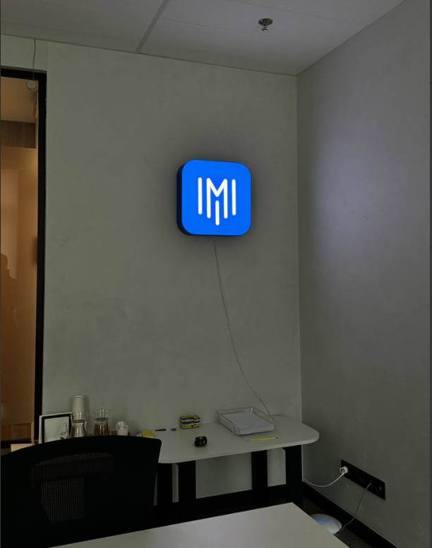 A lamp in shape of app icon with your logo/text
